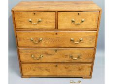 A 19thC. two piece oak military campaign chest of drawers with brass fittings (part loss to bottom d