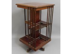 A c.1900 revolving mahogany bookcase, 33in high, a