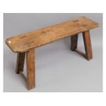 A 19thC. elm joint bench, 29.5in wide x 13.75in hi