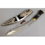 A modern Kukri knife with white metal decor to she