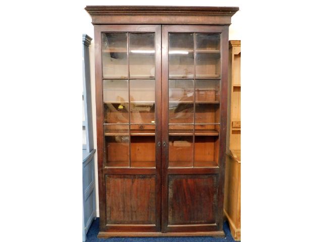 A 19thC. mahogany bookcase, crack to one glass, tw