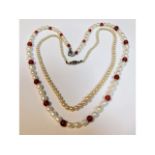 A freshwater pearl necklace 18in long twinned with