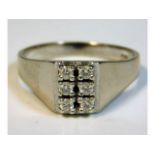 An 18ct white gold ring set with six diamonds, siz