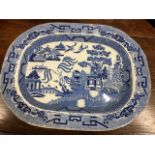 A large 19thC. willow pattern transferware porcela