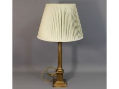 A decorative modern brass lamp of antique styling