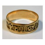 A yellow metal ring with signs of Zodiac design, size R, 2.2g, tests as 14ct gold