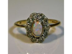 A 9ct gold ring set with diamond & opal, size N, 2