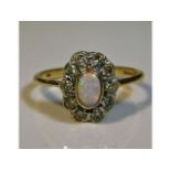 A 9ct gold ring set with diamond & opal, size N, 2