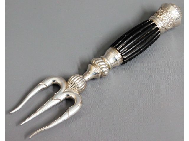 An 1890 Victorian silver bread fork by Deakin & Fr