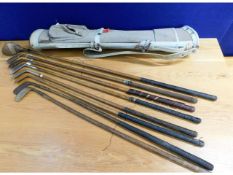 A quantity of hickory golf clubs, seven irons & on