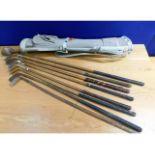 A quantity of hickory golf clubs, seven irons & on