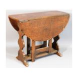 A small 1920's oak gate leg table, 24.25in wide x
