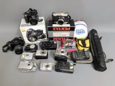 A quantity of various cameras including Nikon, Pentax, Fuji Fine Pix, Canon & other items plus a box