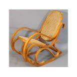A child's cane bentwood style rocking chair, 23in