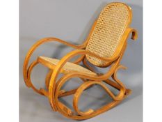 A child's cane bentwood style rocking chair, 23in