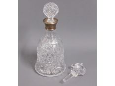 A silver collared crystal decanter 11.75in tall tw