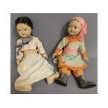 Two early/mid 20thC. Asian dolls with silk type cl