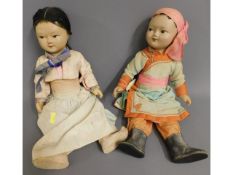 Two early/mid 20thC. Asian dolls with silk type cl