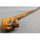 An early 20thC. walking cane with carved boxer typ