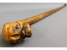 An early 20thC. walking cane with carved boxer typ