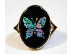 A 9ct gold ring with butterfly design of slices of