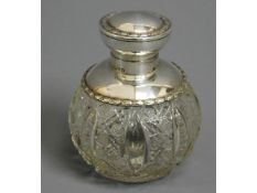 A silver topped & collared glass scent bottle, Che