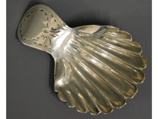 A 1786 George III shell shaped London silver caddy