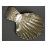 A 1786 George III shell shaped London silver caddy