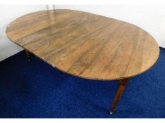 An early 19thC. extending fruitwood dining table, some old worm damage, 76.5in long x 53in wide x 29