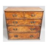 A George II walnut chest of drawers with brass fit