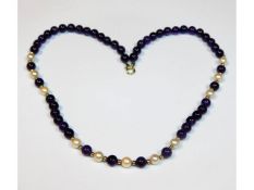 An amethyst, cultured pearl & gold bead necklace,