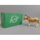 A boxed Beswick donkey, 5.25in tall