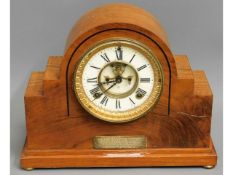 A decorative wooden mantle clock, 10.25in high, pr