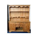 A pine farmhouse dresser with two drawers & cupboa