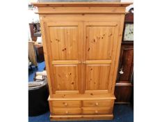 A modern solid pine, three piece double wardrobe w