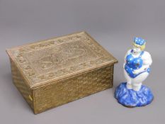 A brass slipper box twinned with a cast iron door