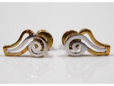 A pair of 9ct two colour gold earrings, 1.2g