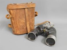 A pair of WW2 military issue binoculars with case