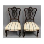 A pair of antique, upholstered nursing chairs