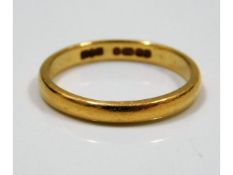 A 22ct gold band, size N, 3.1g