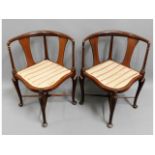 A pair of Edwardian arts & crafts style mahogany c