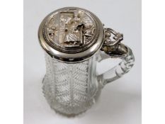 A decorative glass continental stein with decorati