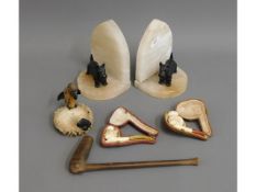 A pair of alabaster book ends with spelter Scottie