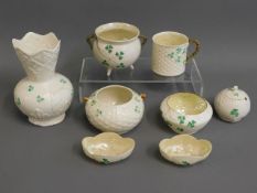 A collection of eight pieces of Belleek porcelain,