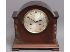 A wooden mantle clock, 11.5in high