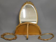 Two small gilt wall mirrors, a larger mirror, 26in