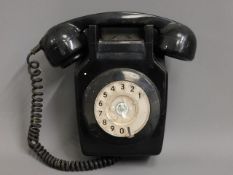 A retro wall mounted telephone