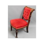 An antique, upholstered nursing chair