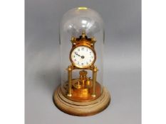 A mid 20thC. glass domed anniversary style clock,