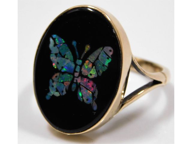 A 9ct gold ring with butterfly design of slices of